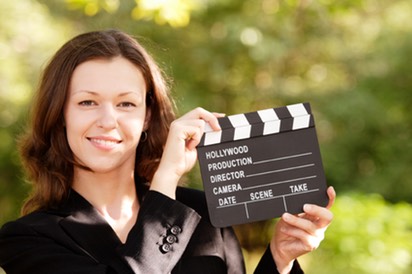Woman with Smile and Closed Clapboard